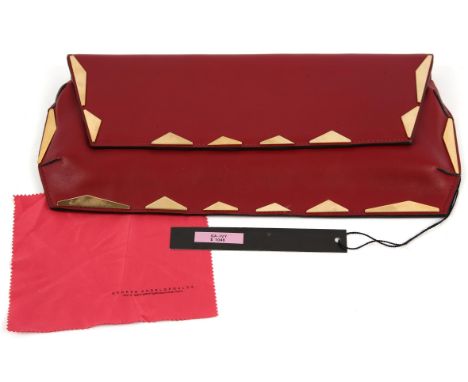 GEORGE ANGELOPOULOS red leather rigid clutch style handbag with gold coloured hardware and black canvas lining.              