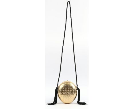 CHRISTIAN DIOR A solid brass or gold coloured metal minaudiere handbag on silk cord (H19cm x W18cm x D14cm)Condition Report: 
