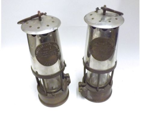 A pair of Vintage Miners Lamps, marked  Protector Lamp and Lighting Eccles , 9  high 