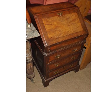 Reproduction miniature Walnut veneered Bureau of typical form, drop down front opening to an interior with steps, drawers, an