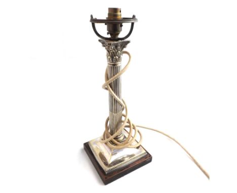 An early 20th Century Electroplated Corinthian Column Candlestick on ebonised base with fluted column (converted to electrici