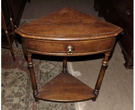 A Simon Simpson Oak Corner Table fitted with single frieze drawer and base shelf, raised on turned legs, complete with copy o