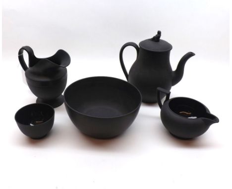 A Wedgwood Black Basalt Composite Tea Set, comprising Slop Bowl, Sugar Basin, two Jugs and a small Teapot, all with slightly 