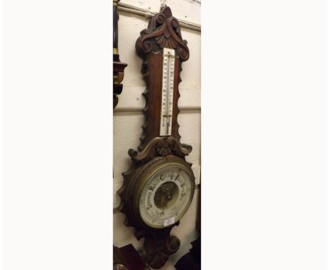 Late 19th Century Oak cased Aneroid Wheel Barometer, the carved foliate case with replacement porcelain twin-scale mercury Th