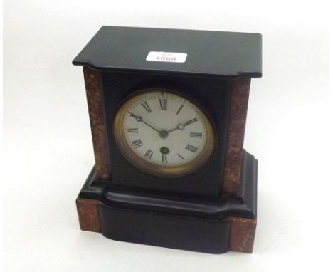Late 19th Century black and variegated Rouge Marble Mantel Timepiece, the plinth shaped case with breakfront to a cast bezel 