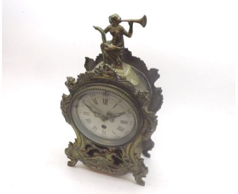 Early 20th Century cast Brass Mantel Timepiece, the waisted case surmounted by a trumpeter and with floral and foliate detail