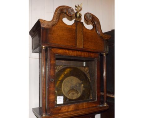 A Walnut cross banded Oak cased Longcase Clock, Brass dial Robt Scholfield, applied at the corners with Rococo spandrels and 