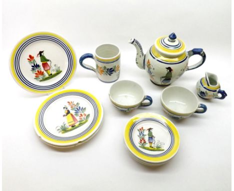 A mixed lot: various Henriot Quimper table wares comprising teapot (A/F), cream jug, tankard, two cups and a range of saucers