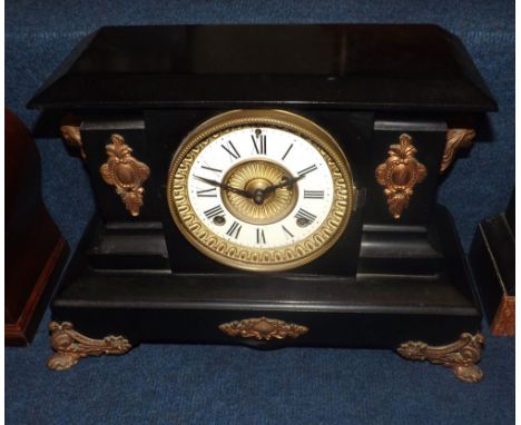 Early 20th Century black painted and bronzed cast metal American Mantel Clock, Ansonia Clock Co, the plinth shaped case with 