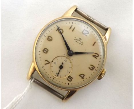 Mid-20th Century 9ct Gold wrist watch, Smiths  De Luxe , the 15 jewel movement to a signed and Silvered circular dial with ap