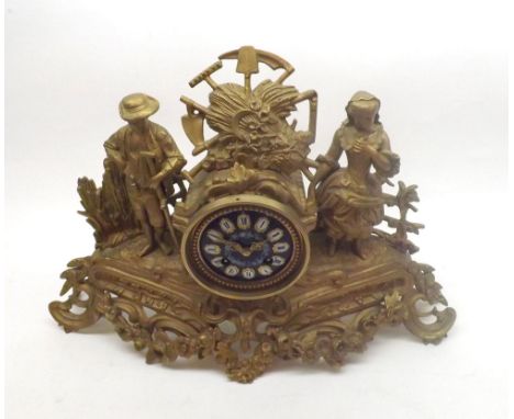 Late 19th Century gilt Spelter figural Mantel Clock (associated), the naturalistic case surmounted by agricultural trophies a