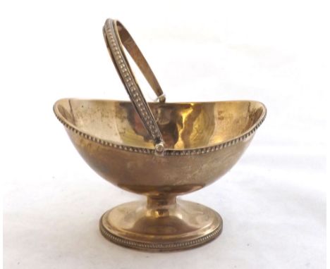 George III Silver Sugar Basin of basket form, hinged looped handle with beaded detail, the body raised on short pedestal and 