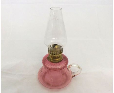 Small chamber Oil Lamp with cranberry glass base and looped clear glass handle, 9 =  high  