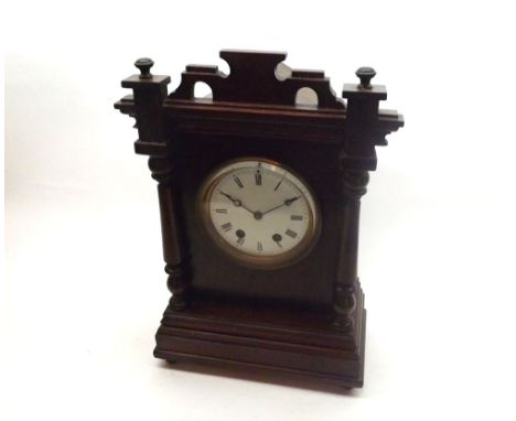Early 20th Century Mahogany cased Mantel Clock, the case with overhanging cornice and shaped pediment over free-standing colu