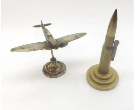 A Mixed Lot comprising: a small Brass Spitfire Model and a further Vintage Table Lighter formed as a brass bullet, largest pi