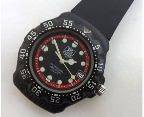 Last quarter of 20th Century black Quartz centre seconds calendar wrist watch, Tag Heuer, 383 513/1, the Quartz movement to a