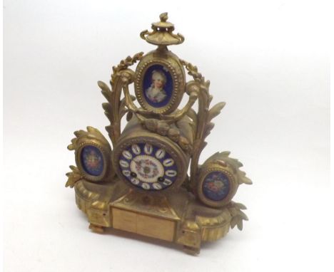 Late 19th Century gilt Spelter and porcelain mounted Mantel Clock, the drum shaped case surmounted by a flaming urn over an o