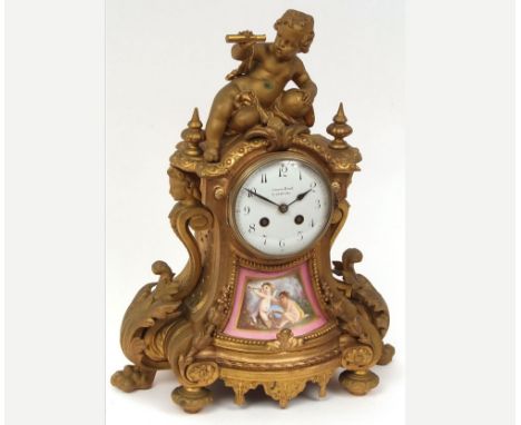 Early 20th Century figural gilt Spelter and porcelain Mantel Clock retailed by Morath Bros   Liverpool, the waisted case surm