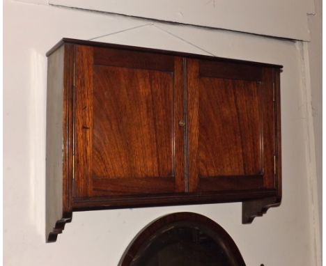 A small late Victorian American Walnut Two Door Wall Cabinet of rectangular form, the interior with single shelf, 24  wide  