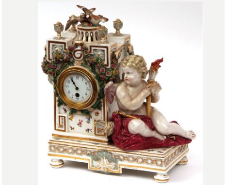 Early 20th Century Meissen porcelain cased Mantel Timepiece, the rectangular base on gilt highlighted and bladed feet and set