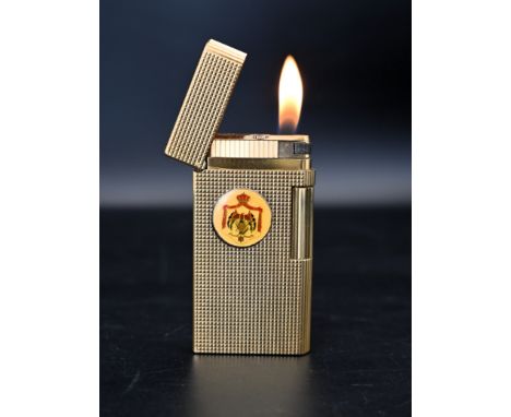 Caran D`ache Geneve gold plated cigarette lighter with the King Hussein of Jordan's insignia. The lighter was gifted to the v