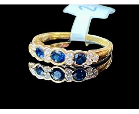 18ct gold diamond and sapphire half eternity ring, size P, total weight 3.15g - has a very small diamond missing at the edge 