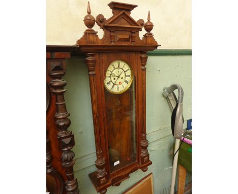 Large Black Forest style Vienna wall clock with mixed woods with burr walnut book matched backboard, the weight driven moveme