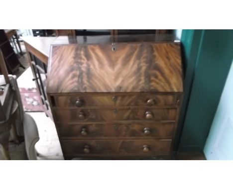 Georgian figured mahogany four leaf bureau, fitted four long graduated drawers each with bobbin handles, the fall leaf interi