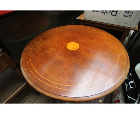 Shell inlaid circular topped occasional table with  four splayed feet united by under shelf