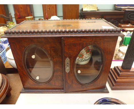 Beaded oak tobacco cabinet inset three small drawers, clay pipe, hand painted lidded tobacco jar