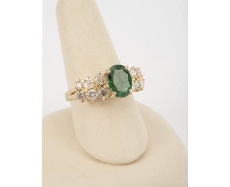 DESCRIPTION: 14k ring set with approximately 1.8 carat emerald (9mm x 7mm), four ten point diamonds, four eight point diamond