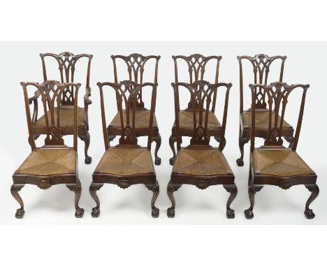 DESCRIPTION: Eight Chippendale style mahogany dining chairs. Early 20th century. Carved and molded top rails, serpentine seat