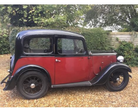 A 1935 Austin Seven Ruby saloon, registration number EMX 633, maroon over black. New for 1934 the Ruby was significant step i