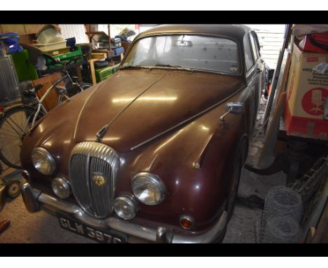 A 1965 Daimler V8 250, registration number GLW 397C, chassis number 1A9367BW, engine number 7A9957, maroon.  With only 46,000
