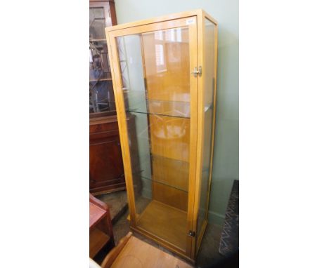 A light oak glazed single door shop display cabinet