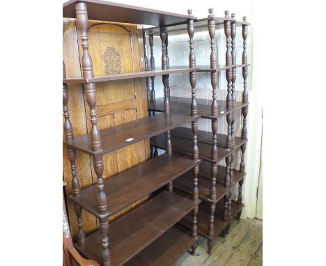 Three modern free standing six shelf bookcases