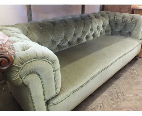 A light green draylon upholstered Chesterfield sofa