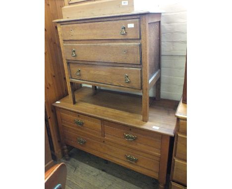 A light oak chest of three drawers and a satinwood chest of two short and one long drawer