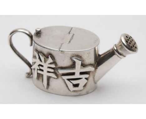 A Chinese novelty silver pepper, maker CS:  in the form of a watering can, the sides decorated with characters for good luck 