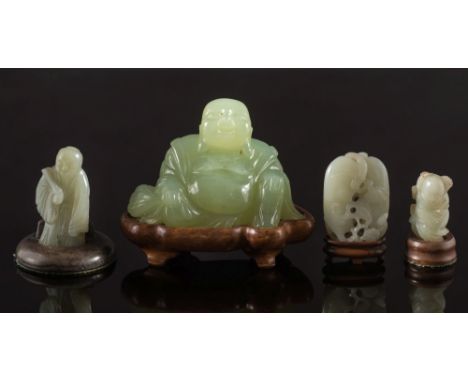 Three Chinese jade carvings and a hardstone figure of Budai:  the first of two bean pods with stalks and foliage, the stone o