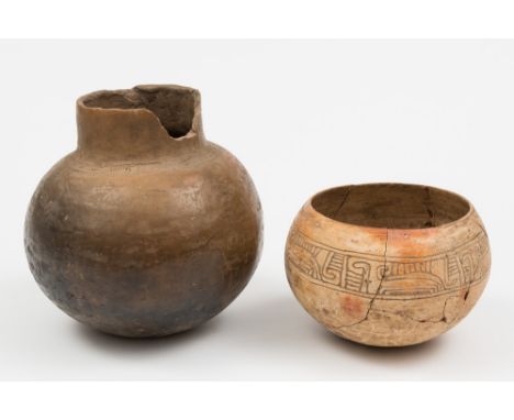 A Mayan pottery bowl and a pottery cooking pot: the thinly potted bowl decorated with an incised band of hooked motifs, 19 cm