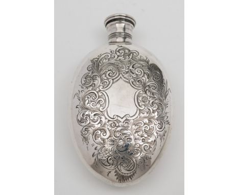 A Victorian provincial silver spirit flask, maker J.B, Exeter, 1853: of oval form with screw cap and engraved foliate decorat