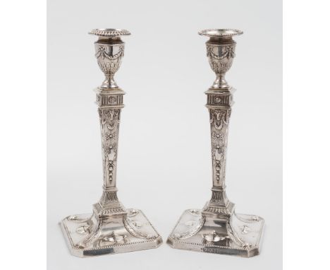 A pair of Victorian silver candlestick, maker Richard Martin & Ebenezer Hall, Sheffield, 1899: of neo-classical form, with ga