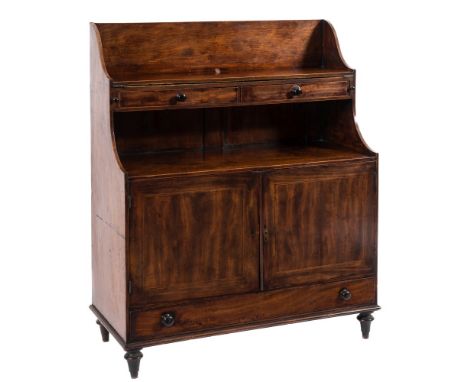 An unusual late George III mahogany and inlaid low graduated bookcase/writing desk:, bordered with boxwood lines, the three q