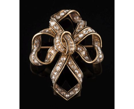 A 19th century enamelled gold and diamond mounted ribbon bow brooch:, the ribbon of quatre-foil design pave-set with rose-cut