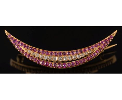 A French gold,ruby and diamond crescent brooch: the central row of graduated round old brilliant and rose-cut diamonds betwee