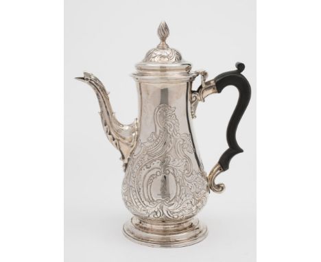 A George III silver coffee pot, maker Francis Crump, London, 1766: crested, of baluster form with later foliate and scroll de