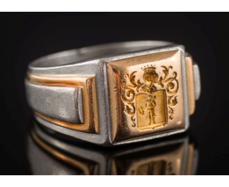 A French platinum and gold seal ring: with armorial intaglio, ring size W, 26.7gms gross weight. 