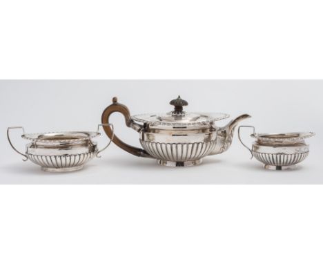 A Victorian silver three-piece tea service, maker Charles Stuart Harris, London, 1888, 1890/91: of circular form with gadroon