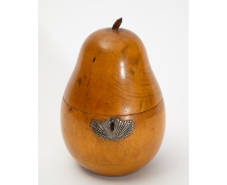A 19th century fruitwood pear-shaped tea caddy: with silver escutcheon of foliate design 17cm. high.